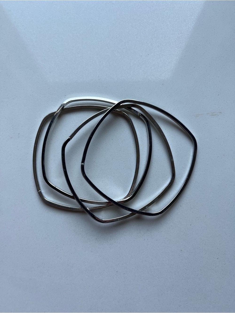 Set of 4 Geometric Silver Tone Bangle Bracelets